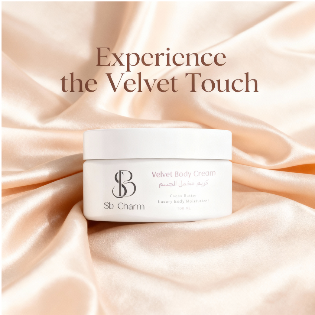 Sb Charm Velvet Body Cream with an orchid on a marble surface with greenery in the background